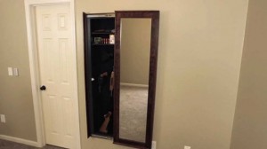 Hidden in wall mirror safe.